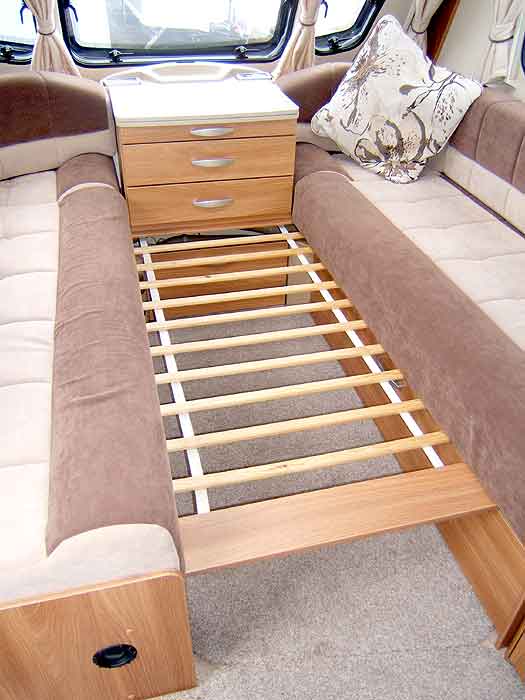 This 'array' of wooden slats pulls out from under the draw cabinet and aids the process of converting the front lounge to and from a sleeping area.